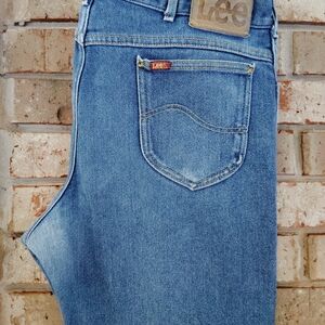 The product is a pair of vintage 1980s Lee Riders USA distressed indigo denim hi